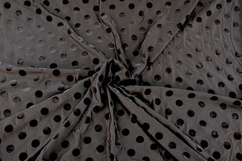 Lycra met print - zwart met vloeren stippen